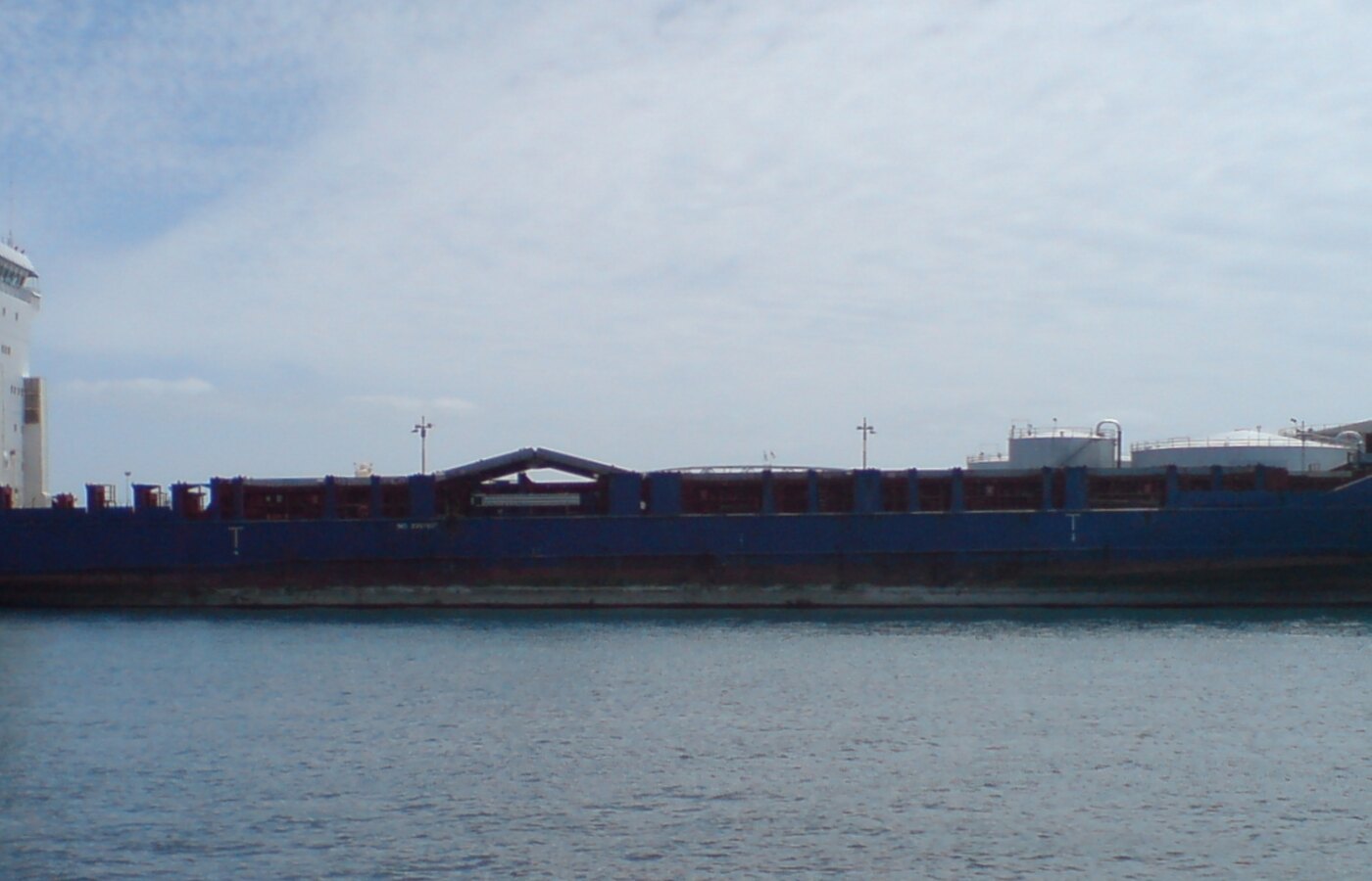 Deep-sea chemical tanker vessel berthed at Kluizendok marine terminal jetty