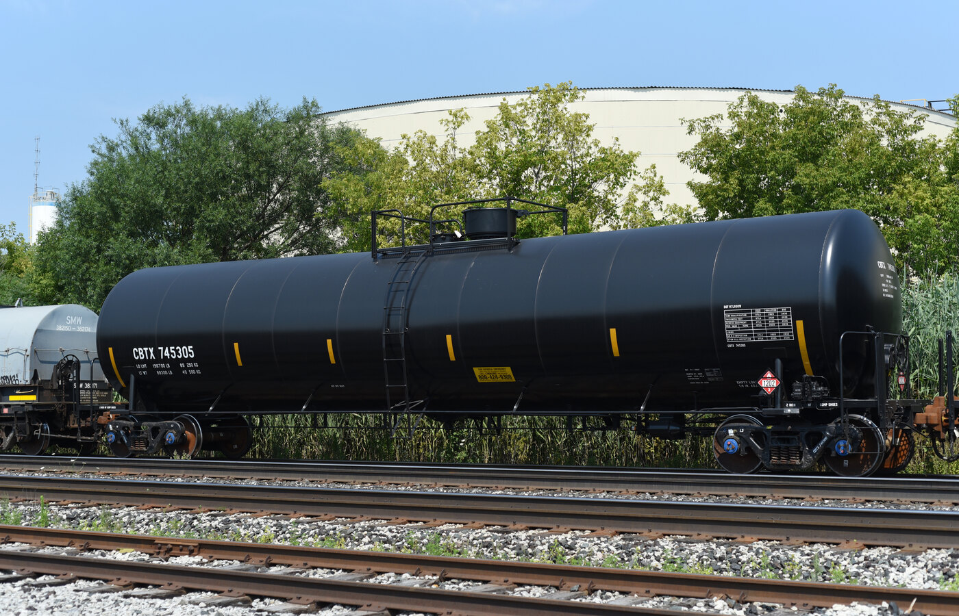 Intermodal freight train rail tank cars and loading infrastructure at terminal sidings