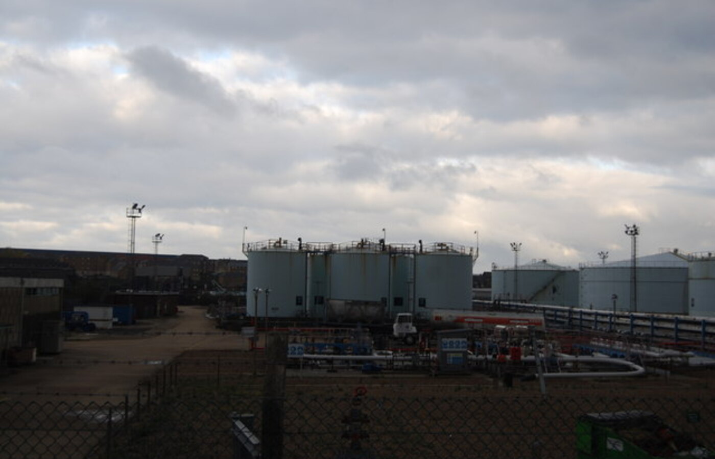 Industrial liquid bulk storage tank farm with concrete bund containment in Ghent